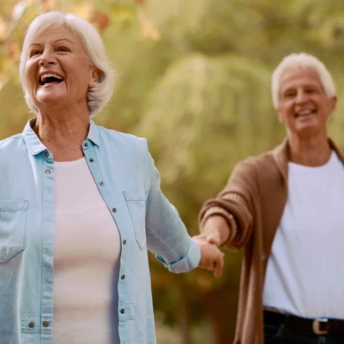 senior-couple-holding-hands-and-happy-smiling